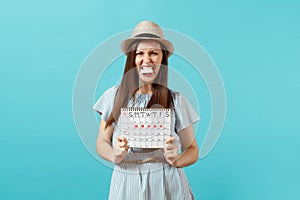 Angry shocked woman in blue dress, hat holding tampon in mouth, female periods calendar for checking menstruation days