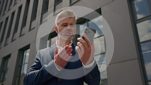 Angry stressed aggressive shouting mad senior business man arguing conflict dispute job problem talking mobile phone