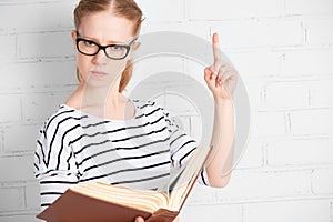 Angry strict serious teacher student with book