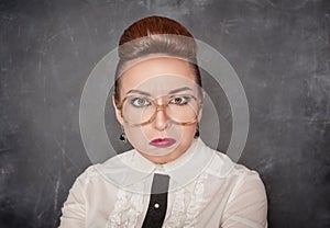 Angry teacher with eyeglasses