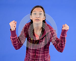 Angry teen girl with braids with fists up