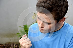 Angry teenager with clenched  fists