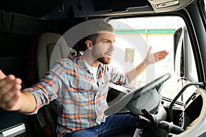 Angry truck driver shouting in his vehicle