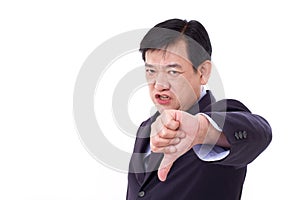 Angry, upset, serious businessman giving thumb down