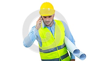 Angry upset young construction engineer yeling at the phone