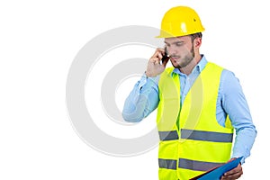 Angry upset young construction engineer yeling at the phone