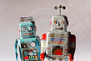 Angry vintage tin toy robots, artificial intelligence, robotic delivery concept