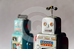 Angry vintage tin toy robots, artificial intelligence, robotic delivery concept