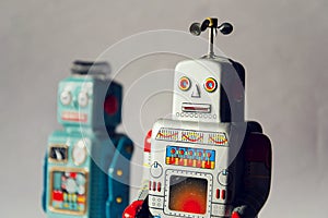 Angry vintage tin toy robots, artificial intelligence, robotic delivery concept