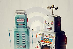 Angry vintage tin toy robots, artificial intelligence, robotic delivery concept