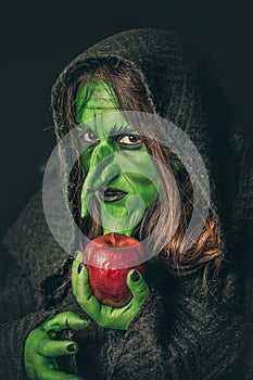 Angry witch with a rotten apple