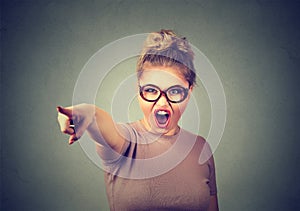 Angry woman accusing screaming pointing with finger