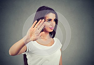 Angry woman with bad attitude giving talk to hand gesture