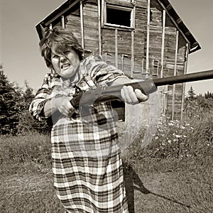 Angry woman with big gun