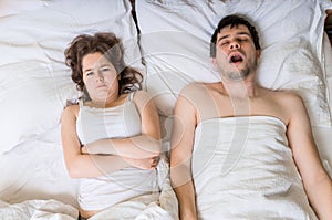 Angry woman cant sleep and listening her husband snoring