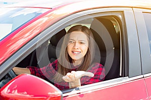 Angry woman driver screaming in the car.