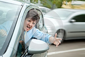 Angry Woman Driver Shouts photo