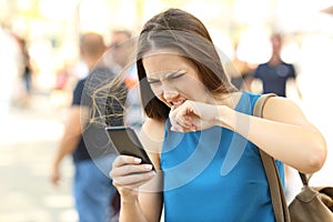 Angry woman fed up of her phone