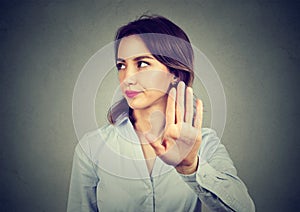 Angry woman giving talk to hand gesture photo