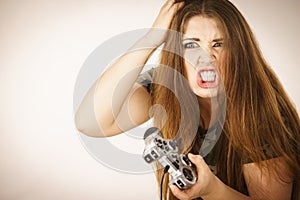 Angry woman holding gaming pad