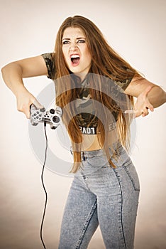 Angry woman holding gaming pad