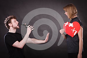 Angry woman and man addicted to alcohol. Broken heart.