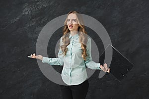 Angry woman with notepad on white background