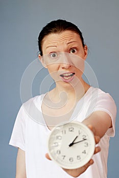 Angry woman pointing on clock Time Management