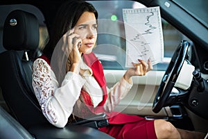 Angry woman professional business owner swear with employees through mobile phone