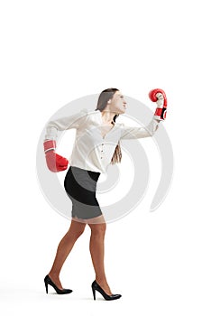 Angry woman in red boxing gloves