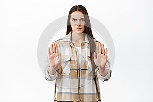 Angry woman say no, shows stop block gesture, refuse or reject something bad, decline offer, prohibit, tell to stay away