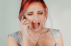 Angry woman screaming on phone