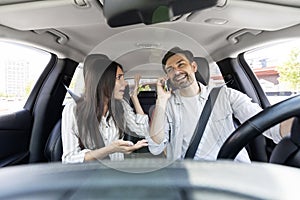 Angry woman shouting while the car driver talking on phone