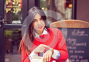 Angry woman showing time on wrist watch