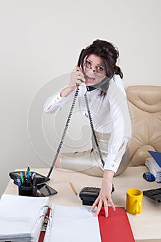 Angry woman talking on the phones photo