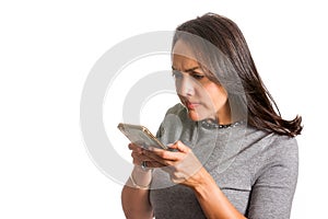 Angry woman texting on her cellphone isolated