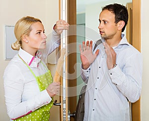 Angry woman threatens with rolling-pin