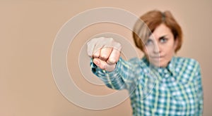 Angry woman throwing a punch