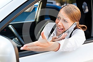 Angry woman in traffic jam