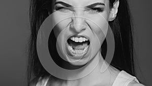Angry woman, upset girl. Screaming, hate, rage. Pensive woman feeling furious mad and crazy stress.