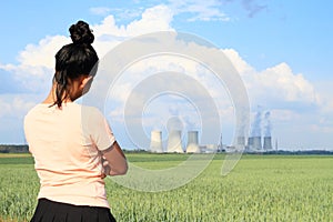 Angry woman watching Nuclear power plant Dukovany photo