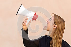 Angry woman yelling into a megaphone