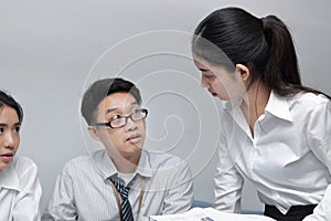 Angry young Asian business woman conflict with her colleague in office. Crisis and confrontation business concept.