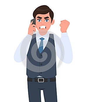 Angry young businessman in waistcoat speaking on phone and gesturing raised hand fist. Frustrated, aggressive person calling