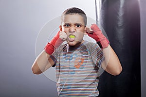 Angry young child boxing
