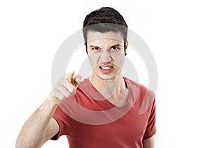 Angry young man pointing on you