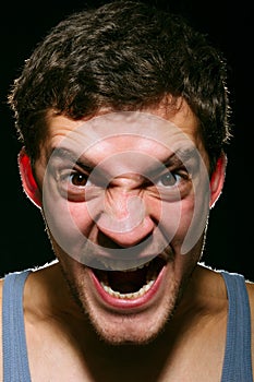 Angry young man shouting.