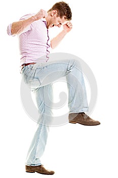 Angry young man smashing something - isolated on white background