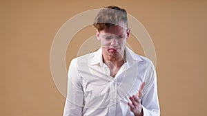 Angry young man in white shirt