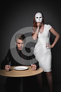 Angry young man beside woman